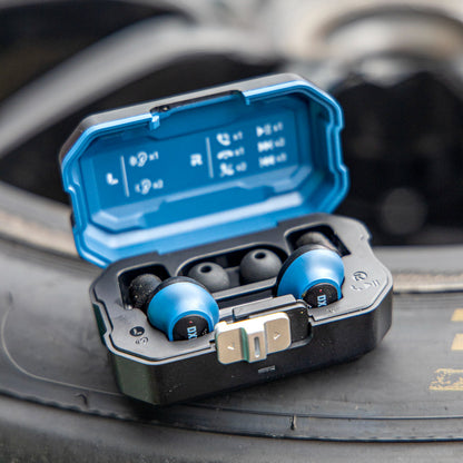 Open DXPULSE Noise Isolating Earbuds with Charging Case on a tyre