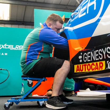 Man using the Man under the EXCELR8 car on the Car Seat by Draper tools