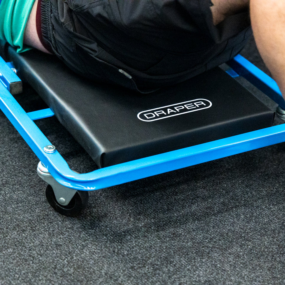 Close-up of a person on the Car Creeper & Seat by Draper tools