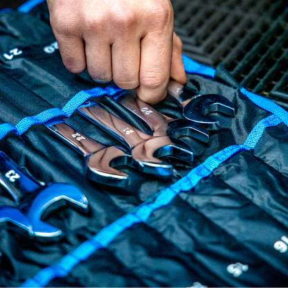 A close-up of a person's hand organising Draper HI-TORQ® Metric Combination Spanner Set