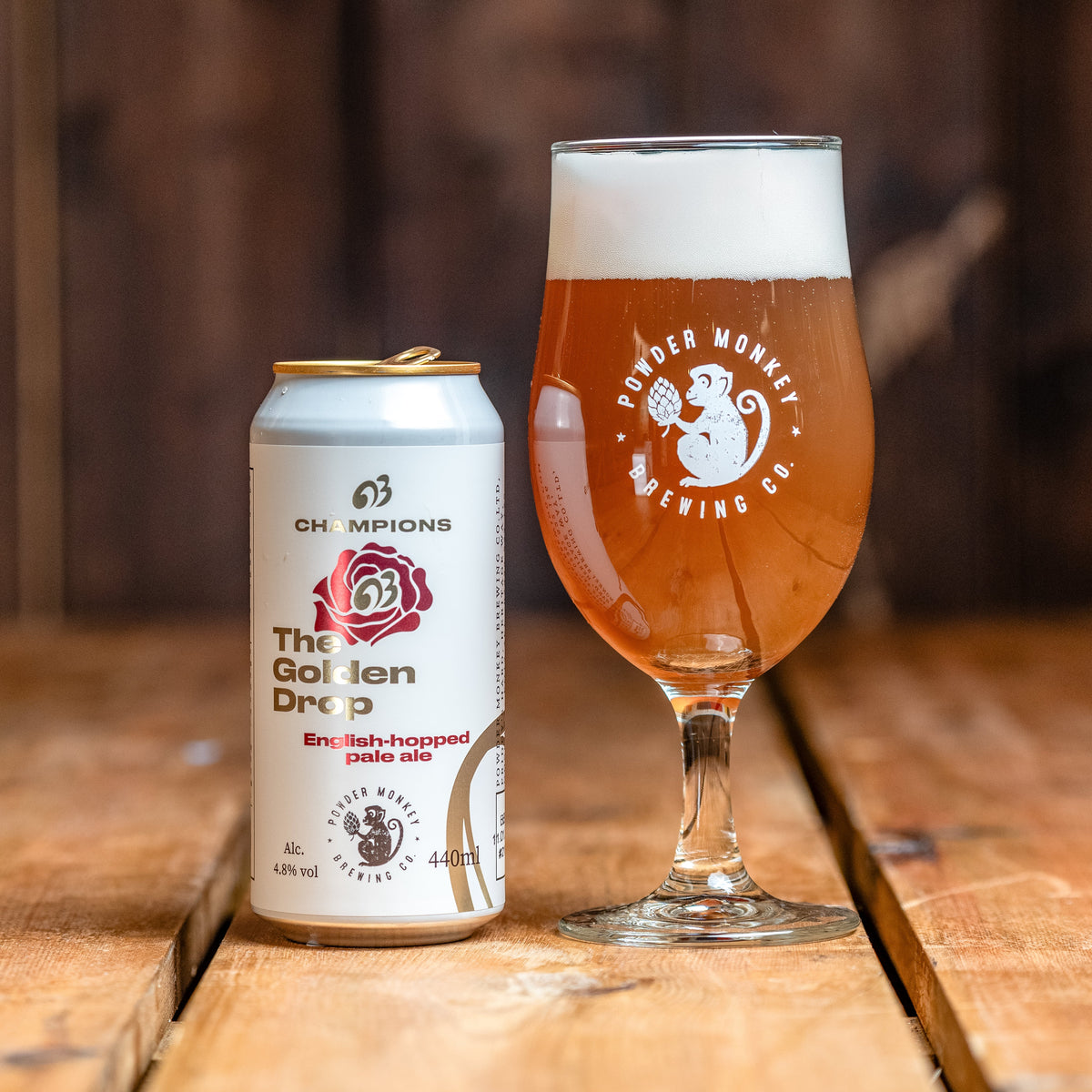 A can of The Golden Drop pale ale next to a beer