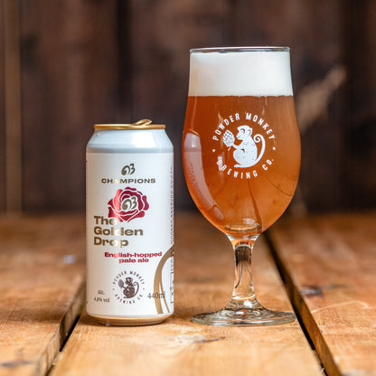 A can of The Golden Drop pale ale next to a beer